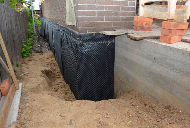 Happy homeowners after waterproofing job in Kalida